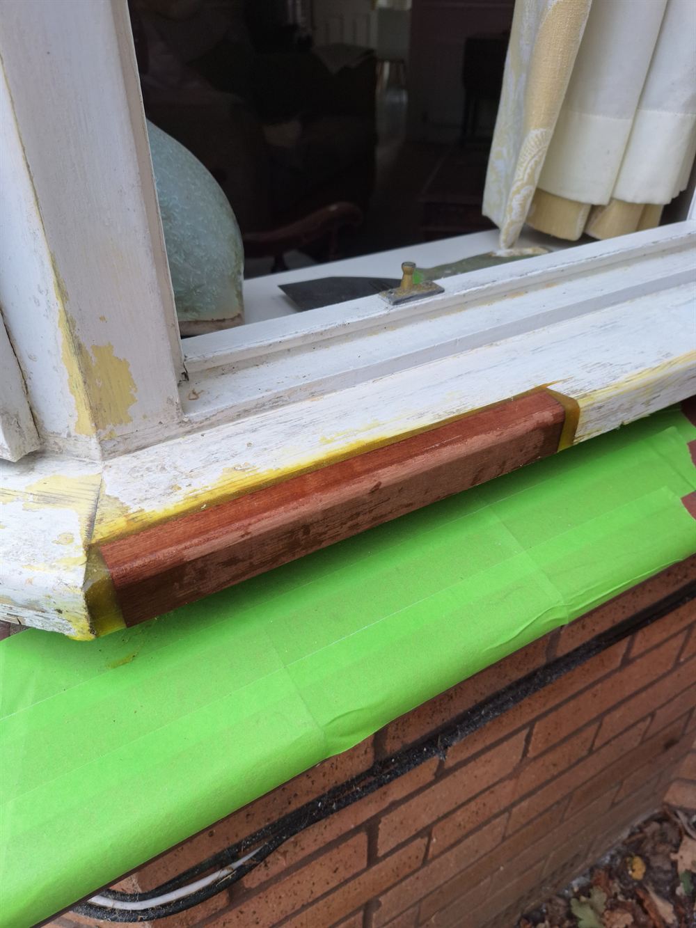 The same cill with a new hardwood section spliced in and bonded ready for painting