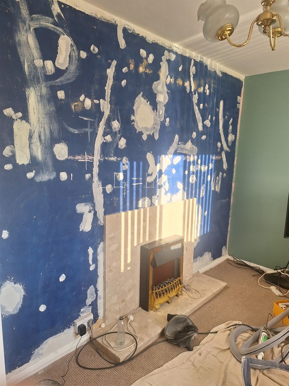 Chimney breast stripped back to bare plaster and filled, ready for lining